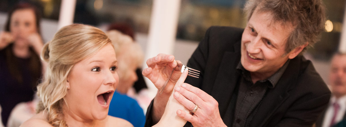 Bending a fork at a table