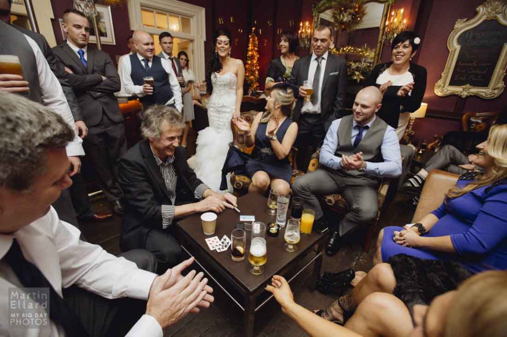 Magician performing magic for guests at a wedding in Brecon